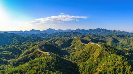 Fototapeta premium Great Wall winds through green mountains.