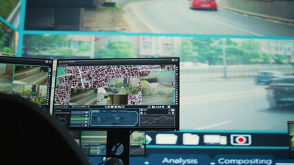 Empty monitoring room with a big screen used to observe traffic through surveillance footage, government satellite CCTV cameras. Public safety agency headquarters monitors the city.