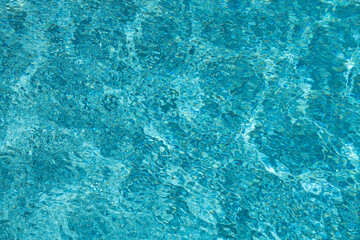 Background of pool water surface. Abstract blue water. Background texture. Water in swimming pool.