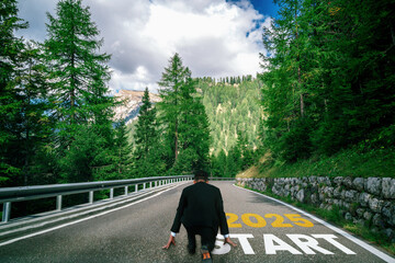 2025 New Year journey and future vision concept . Businessman traveling on highway road leading...