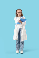 Fototapeta premium Cute doctor with clipboard on blue background