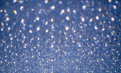 Silver bokeh. Holiday backgrounds. Silver bokeh bright color blurred background. Bokeh glitter background. Silver snow bokeh background. Abstract background with copy space.