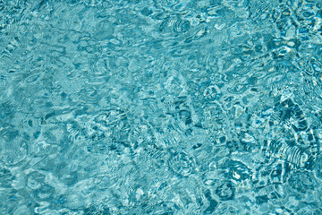 Swimming pool water. Surface of pool water. Blue ocean or sea water for background. Top view of pool water. Waves for graphic design.
