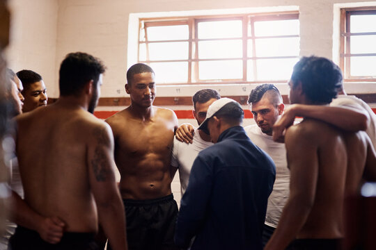 Men, rugby and coaching for team building, exercise or game strategy in locker room for fitness. Male people, huddle and trainer with leadership, mentor and preparation for sports match or challenge