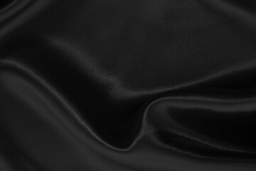Black fabric cloth texture for background and design art work, beautiful crumpled pattern of silk or linen.