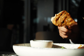 Juicy Grilled Chicken with Dipping Sauce in Fine Dining Setting