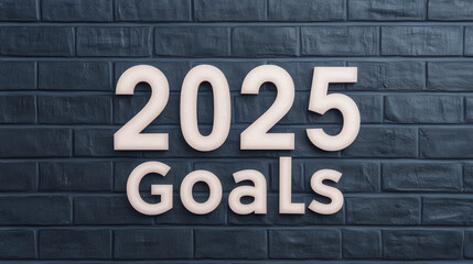 Obraz premium 2025 goals displayed in clean serif font against textured dark wall, symbolizing ambition and future aspirations