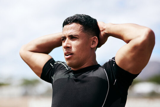 Tired athlete, stress and man outdoor for match loss, fitness challenge or thinking of rugby and breathing. Player, sports and fail competition, game defeat and disappointed with poor performance