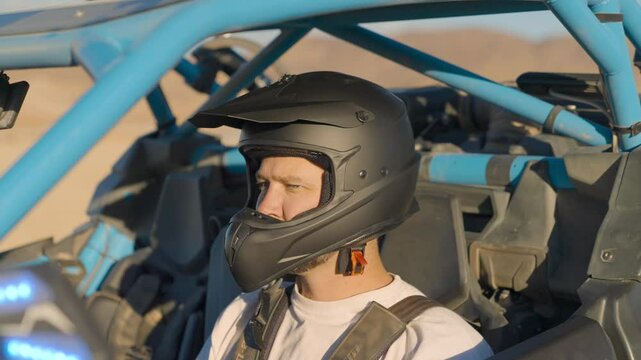 Man buckling helmet