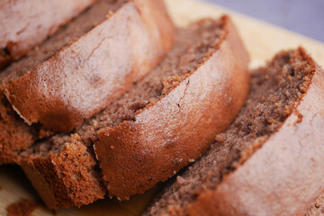 Irresistibly Delicious Chocolate Loaf Cake Slices Arranged on a Wooden Board