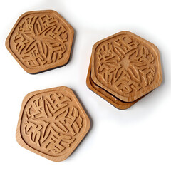 Intricately designed hexagonal wooden coasters perfect for home decor and functional use, photography of still life concept.