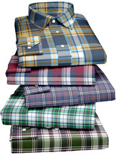 A stack of plaid structured shirt.