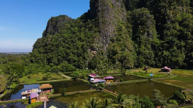 Rammang-Rammang Karst Village, Sulawesi, Indonesia &ndash; A Small Settlement Situated Among Rice Fields - Pan Down Shot