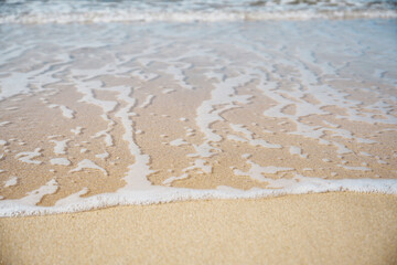 a sea of waves and a sandy beach