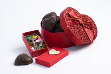 red heart shaped box with chocolates