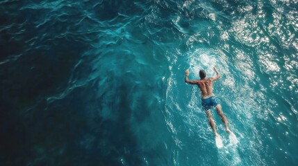 Aerial View of a Man Freestyling in the Azure Ocean Waters