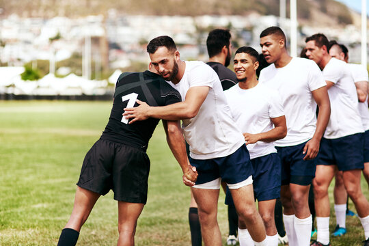 Rugby, team and hug for respect, introduction or sportsmanship on grass field outdoors. Sports men shaking hands and greeting for game rival, competition or training with workout and exercise