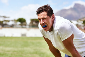 Man, rugby and tired on match at field with sweat for sports game, tournament and competition in...