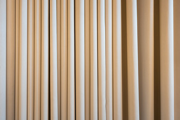 Fototapeta premium Cream colored cloth, beige curtain fabric texture and background. Curtain fabric texture background