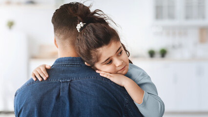 Closeup Shot Of Caring Dad Comforting Upset Little Arab Daughter At Home, Cute Sad Middle Eastern Female Child Hugging Father In Kitchen, Feeling Parent Support And Protection, Free Space