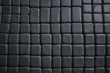 Fototapeta premium a close up of a black tiled floor with a red stop sign