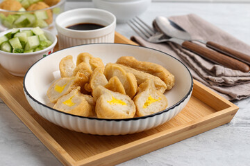 Pempek or Indonesian fish cake. Made from fish and flour. served with cuko. originated from palembang, sumatera. Perfect for recipe, article, catalogue, photo illustration, or any commercial purposes.