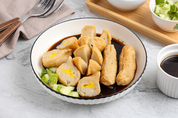 Pempek or Indonesian fish cake. Made from fish and flour. served with cuko. originated from palembang, sumatera. Perfect for recipe, article, catalogue, photo illustration, or any commercial purposes.
