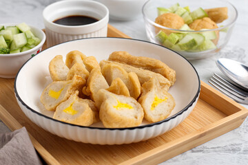 Pempek or Indonesian fish cake. Made from fish and flour. served with cuko. originated from palembang, sumatera. Perfect for recipe, article, catalogue, photo illustration, or any commercial purposes.
