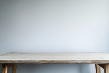 Minimalist wooden table against a plain background.