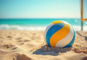 Obraz premium Beach volleyball sits in soft sand beside the sparkling ocean under a bright blue sky