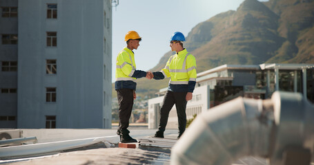 Men, air conditioning and handshake with construction, engineer and team for maintenance on roof in city. People, partnership and deal with agreement, solution or ac repair with hvac system in town