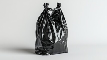 A studio shot of a sleek black garbage bag standing upright on a minimalist white background, its glossy surface reflecting soft studio lights, emphasizing its clean curves and textures