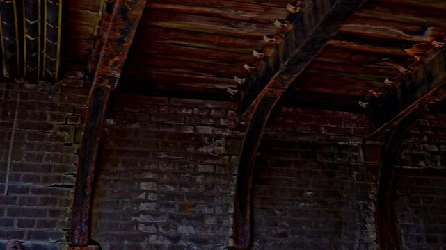 Beautiful old brick walls and wooden beams under bridge