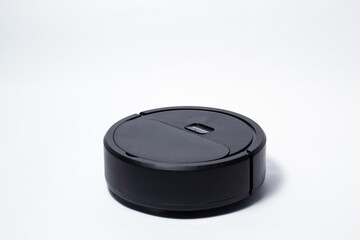 Robotic mini cheap vacuum cleaner on isolated white bakcground