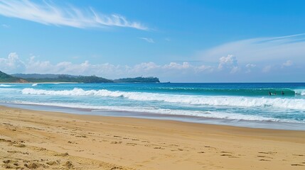 Fototapeta premium Beautiful Sandy Beach with Soft Blue Ocean Wave, Golden Sand, Gentle Ripple, Ideal Place for Relaxation and Enjoying the Seaside Scenery.