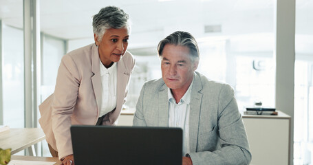Collaboration, laptop and review with business people at desk in office together for management....