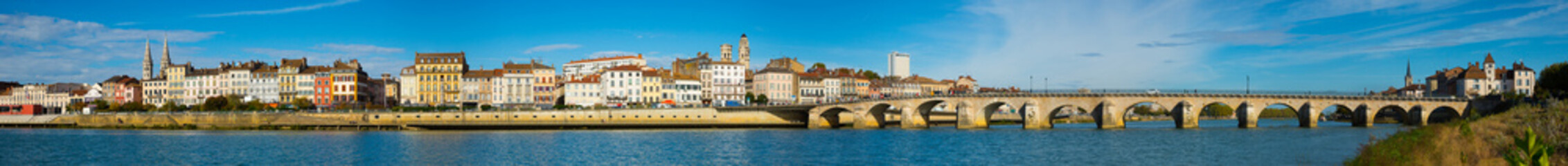 Panoramic view of city of Macon with Saone river on sunny autumn day, Burgundy, France..