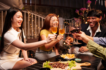 Party Celebrate whiskey at a friendly party in a restaurant. Night.