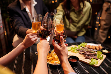 Throw a party Celebrate whiskey at a friendly party in a restaurant. Night.