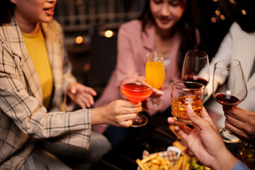 Party Celebrate whiskey at a friendly party in a restaurant. Night.