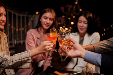Party Celebrate whiskey at a friendly party in a restaurant. Night.