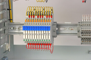 An ultra-thin intermediate relay in an electrical switchboard.