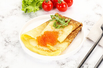 Russian pancake with red caviar