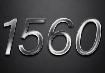 Chrome metal 3D number design of 1560 on grey background.