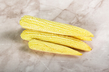 Raw sweet baby corn heap