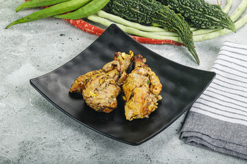 Chicken leg tikka with spices