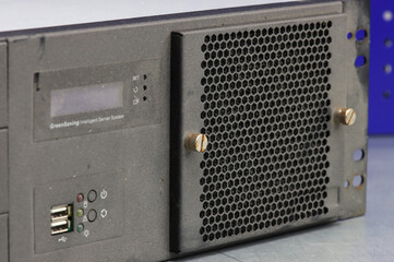 Obraz premium A rusty metal screw securing the computer server panel. Close-up. Soft focus.