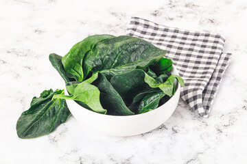 Ripe green spinach leaves heap
