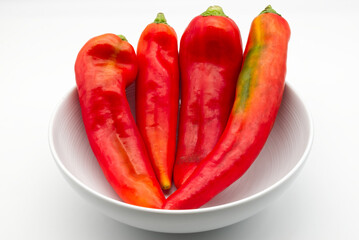 Fresh Red Peppers in a White Bowl
