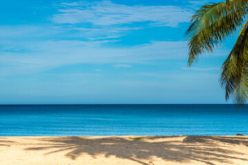 Nature of the beach and sea Summer with sunshine, sandy beaches, clear blue waters sparkling against the blue sky. On an island with good ecology and environment Background for summer vacation concept